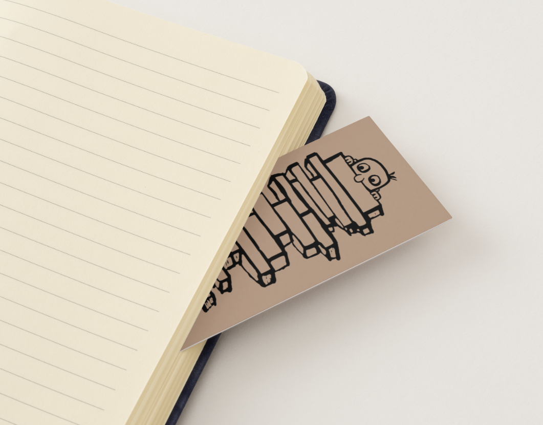 LUCEO bookmark tucked between the pages of a notebook