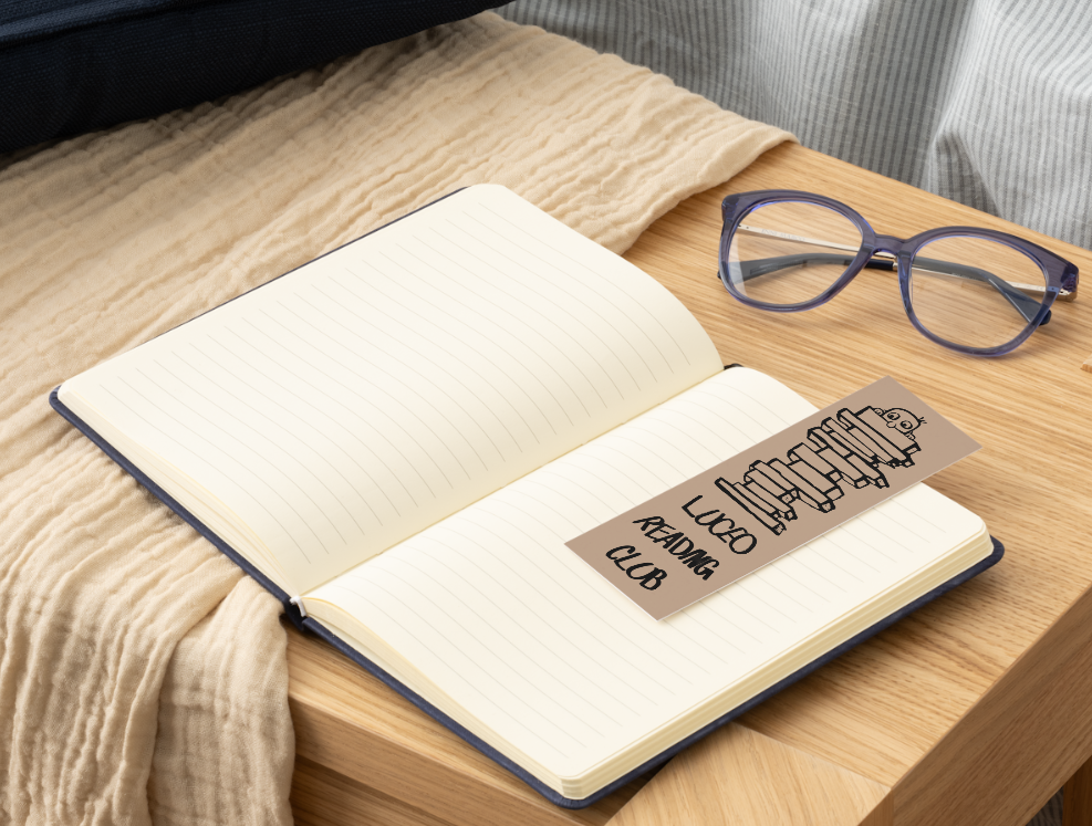 LUCEO bookmark resting across an open notebook